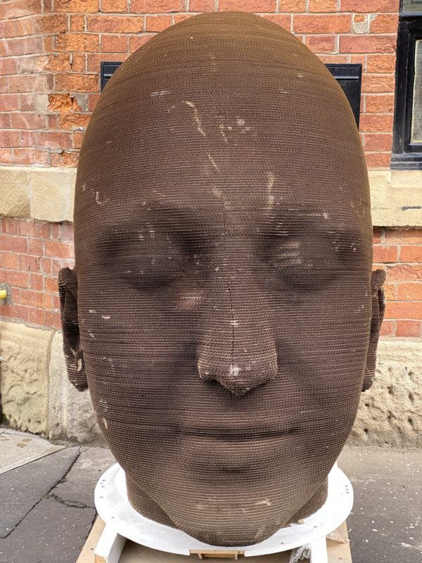 Contemporary Head Sculpture made from cardboard.