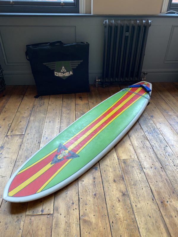 O'Shea surfboard  with bag.