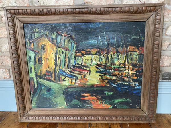 French oil depicting a village harbour scene.