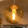 Amber rippled glass pendant globe